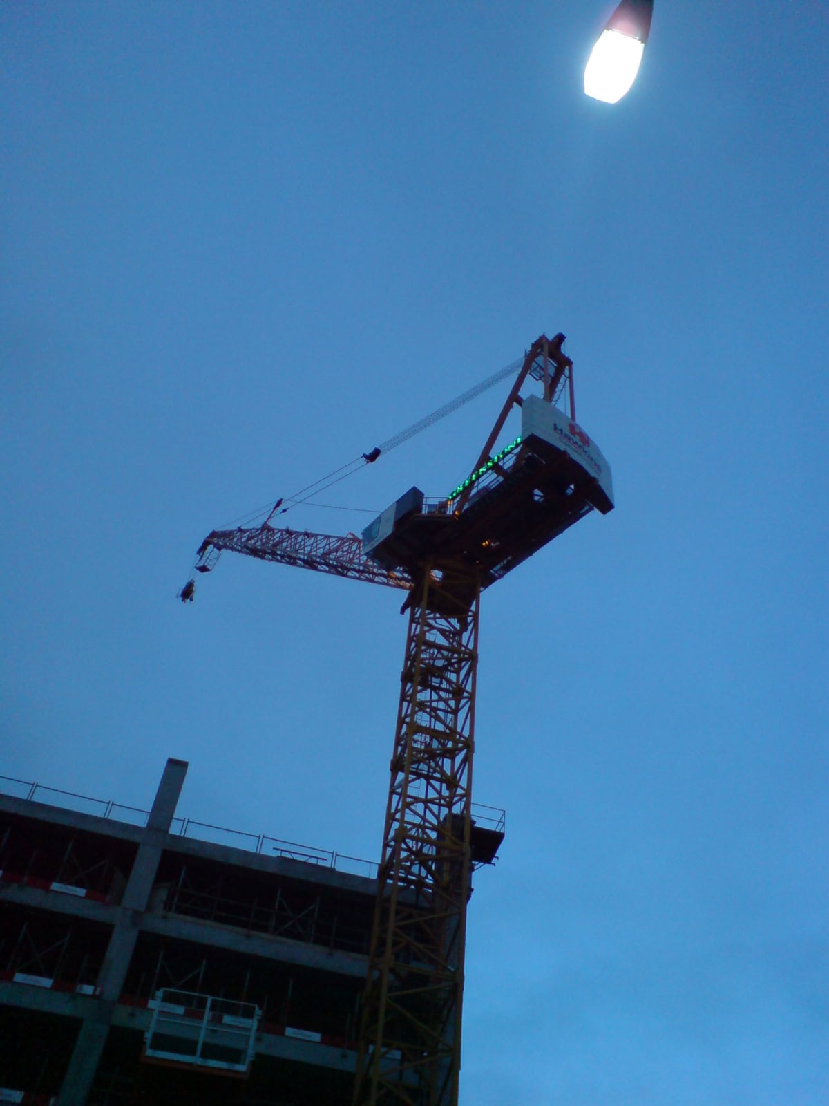 Tower crane over a residential building under construction