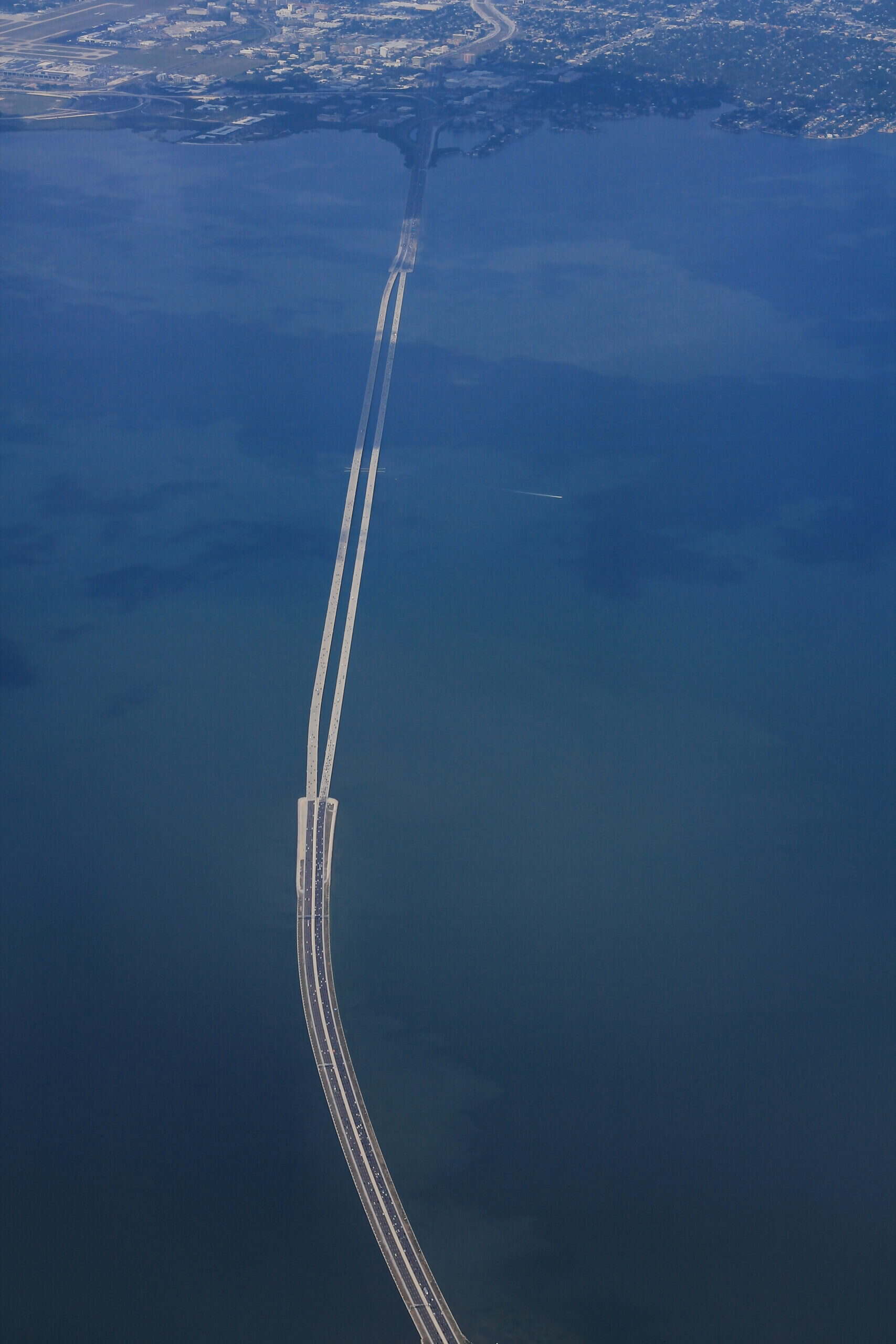 Aerial view of I-275 Howard Frankland Bridge across Tampa Bay facing east