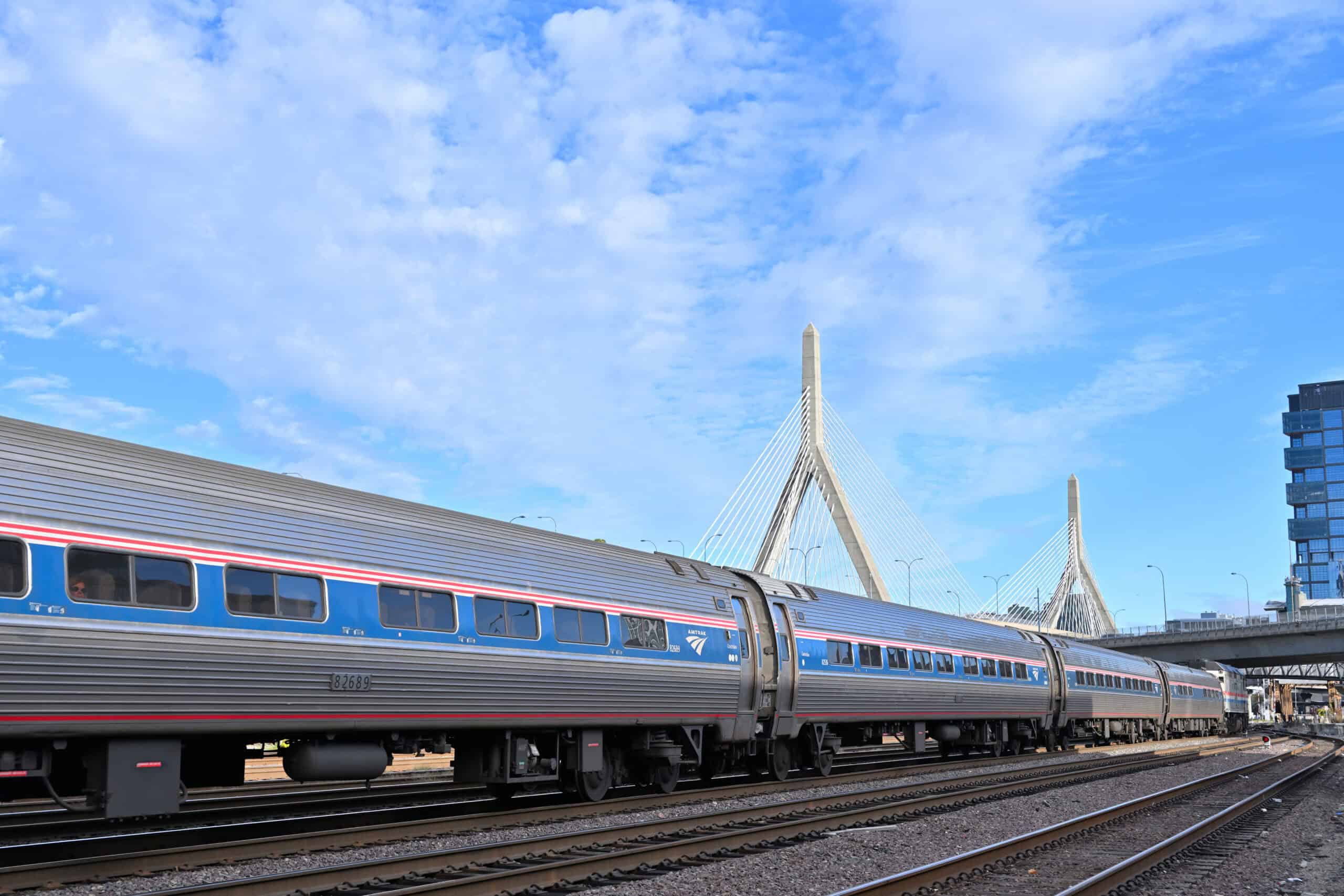 Amtrak Downeaster approaching MBTA North Station across the Charles River draw bridges, September 2024