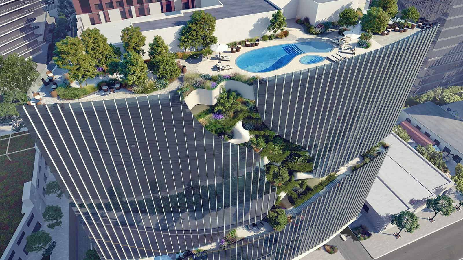 One River North apartment building with a vertical landscaped canyon carved through its facade in Denver's RiNo district