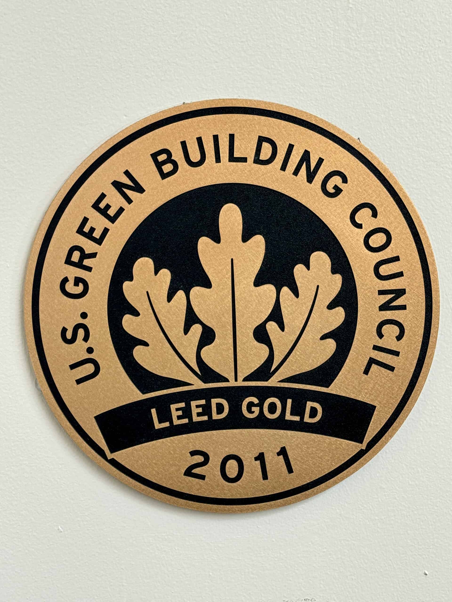 A U.S. Green Building Council LEED Gold certification plaque on a building