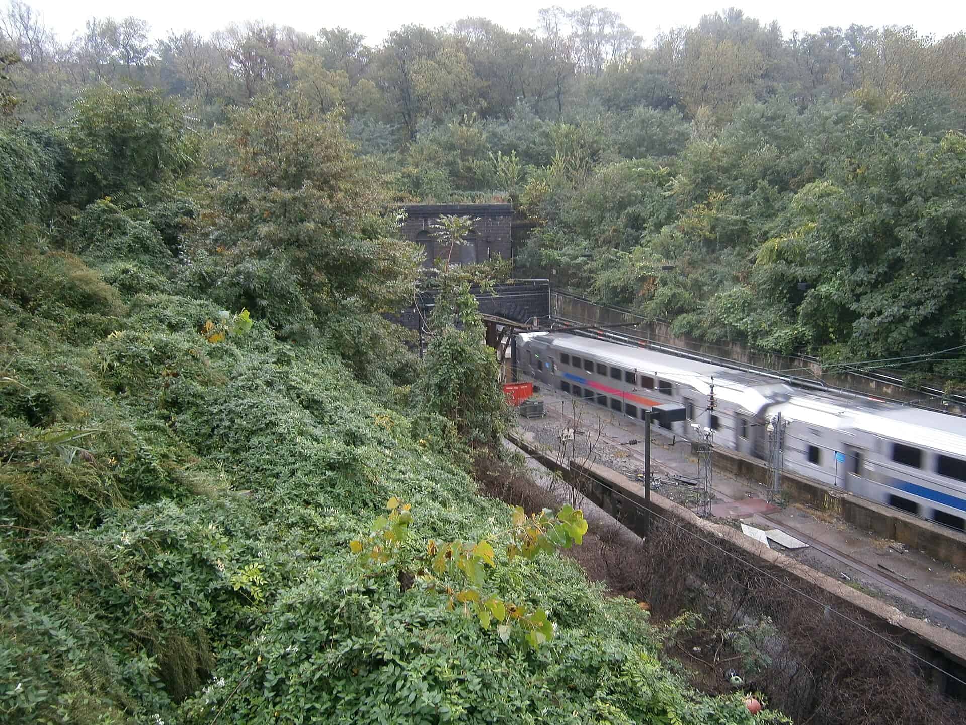 NJ Transit Northeast Corridor train approaching the Hudson Palisades near the North River Tunnels