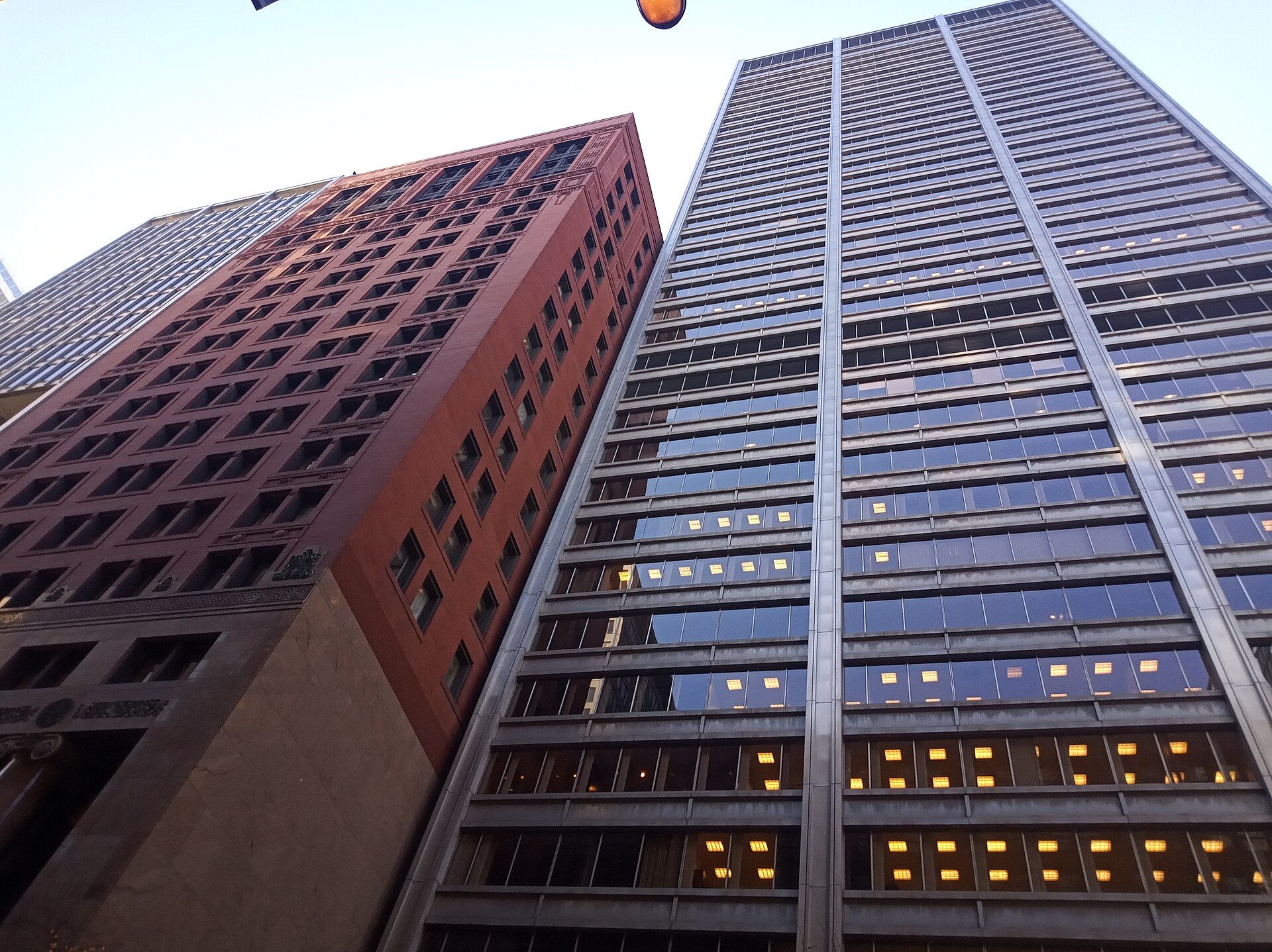 The 111 West Monroe towers in Chicago, the 1911 masonry building beside its 1954 glass addition