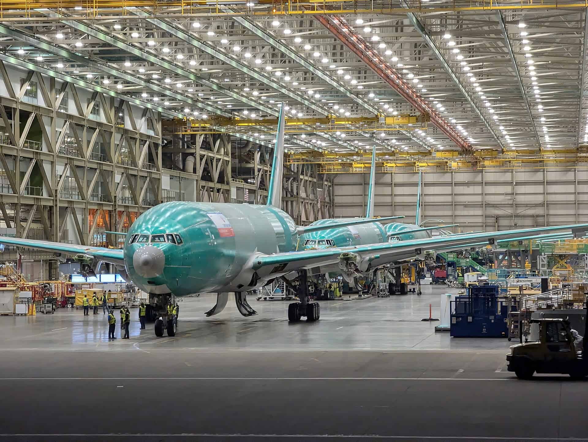 Unpainted widebody fuselage on the assembly floor inside the Boeing Everett factory