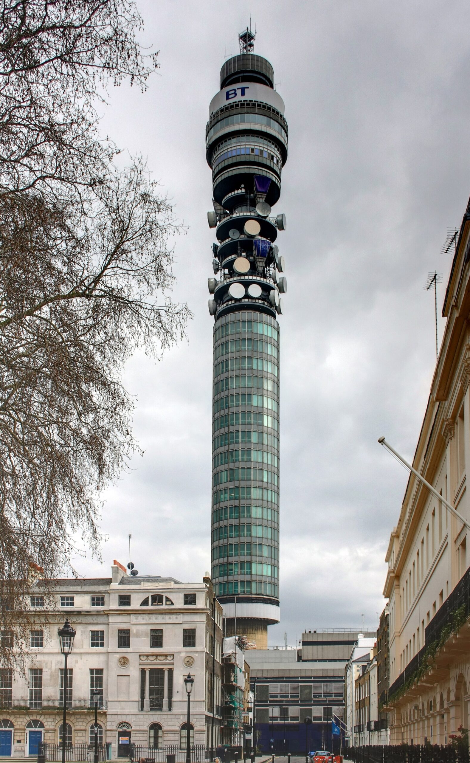 The BT Tower rising above rooftops in Fitzrovia, London, with its aerial galleries visible