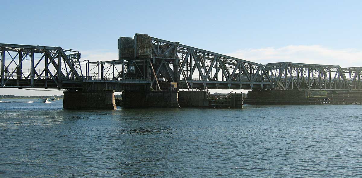 The existing Amtrak Connecticut River rail bridge between Old Saybrook and Old Lyme, seen from the water with its through-truss spans and movable section