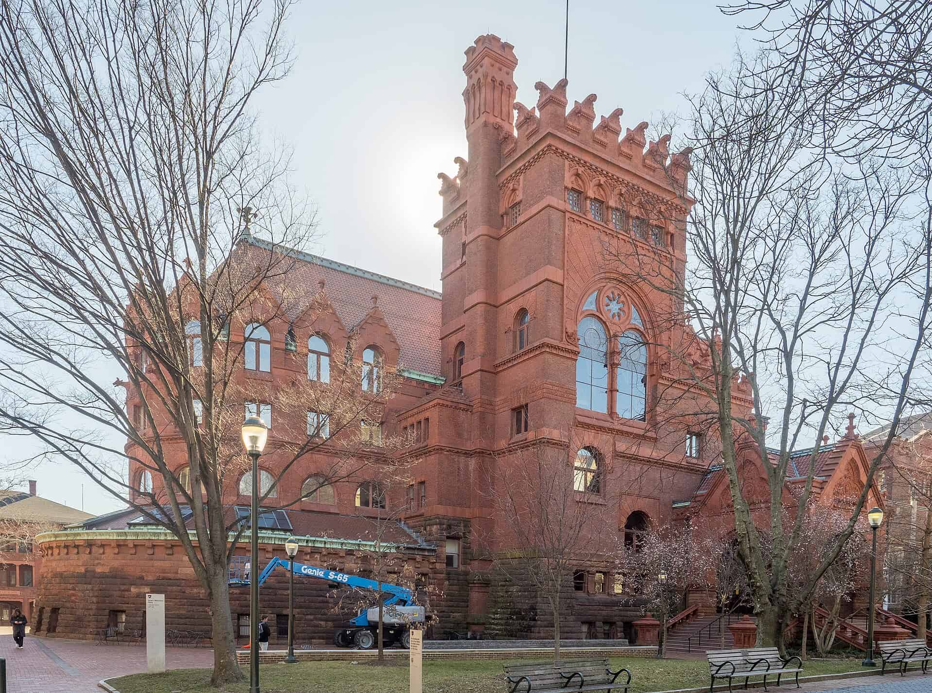 Red sandstone and brick facade of the Fisher Fine Arts Library with a lift positioned at the base