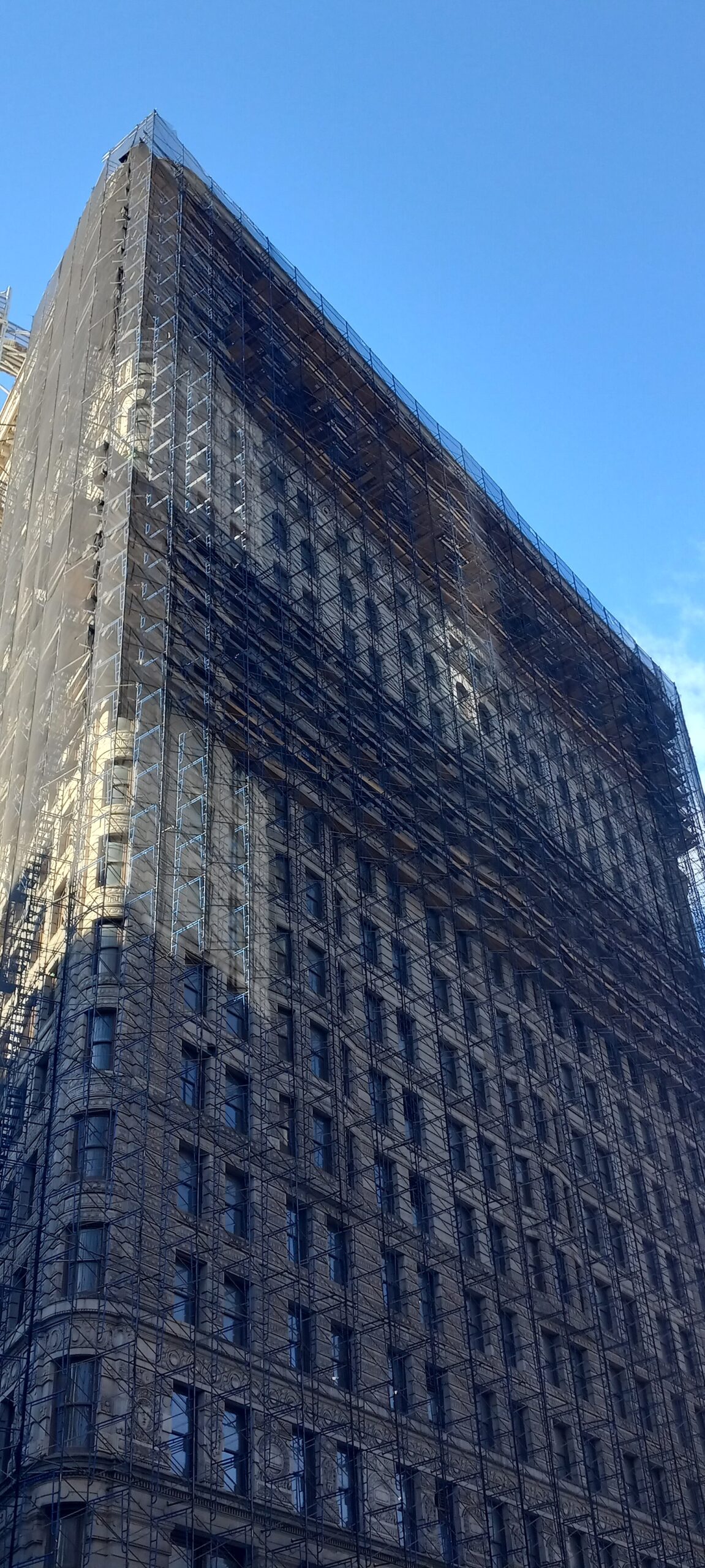 The Flatiron Building at 175 Fifth Avenue in Manhattan, its triangular limestone and terracotta facade seen from the north