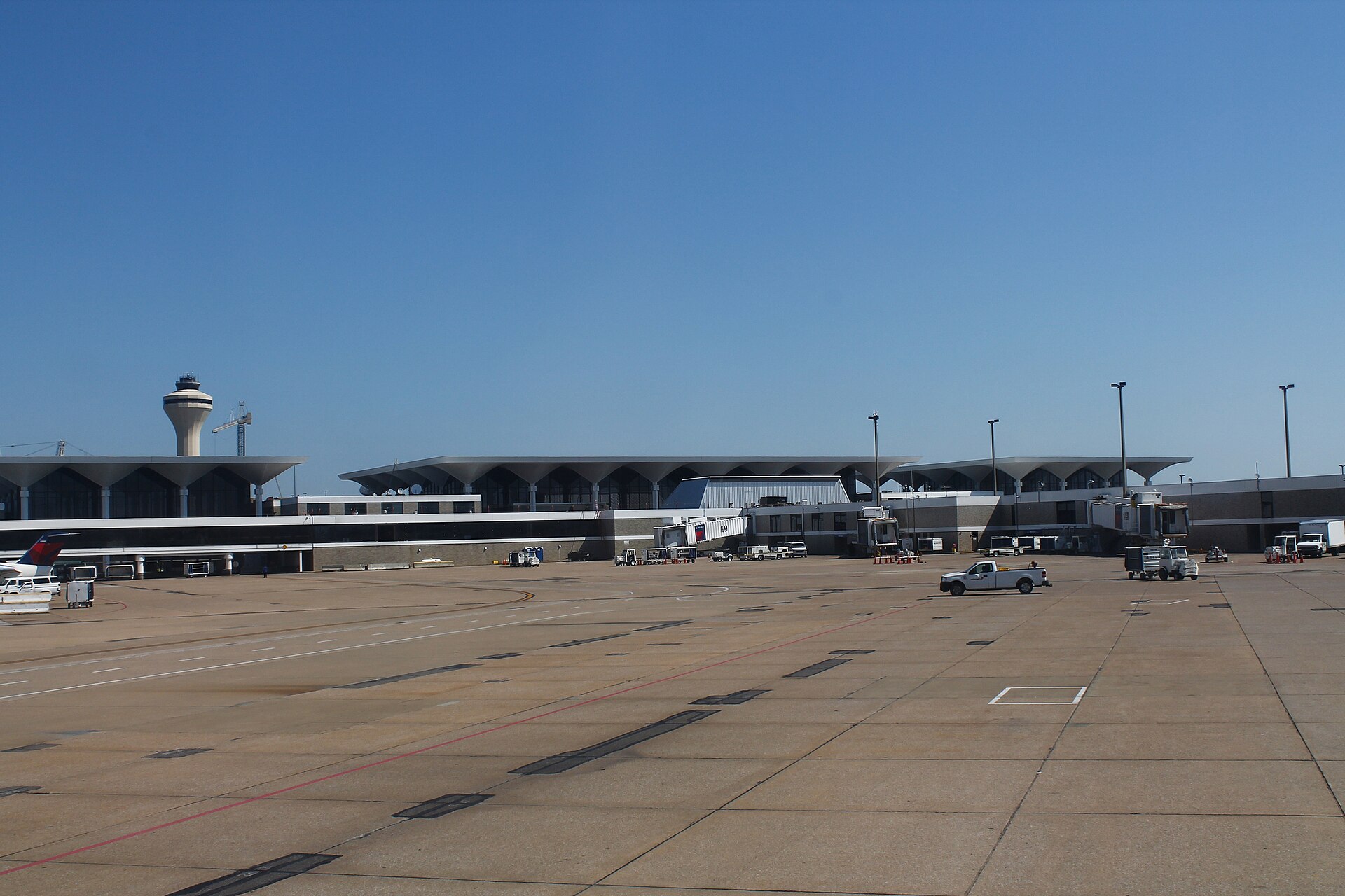 The main terminal at Memphis International Airport seen from the aircraft apron, with its cantilevered roof canopy and control tower