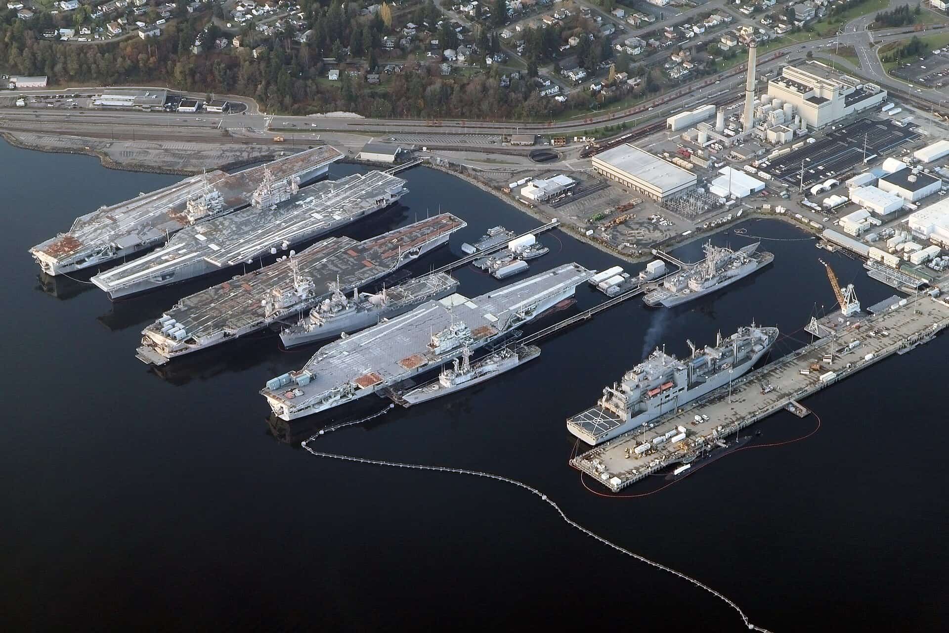 Aerial view of Puget Sound Naval Shipyard at Bremerton with vessels moored along the waterfront
