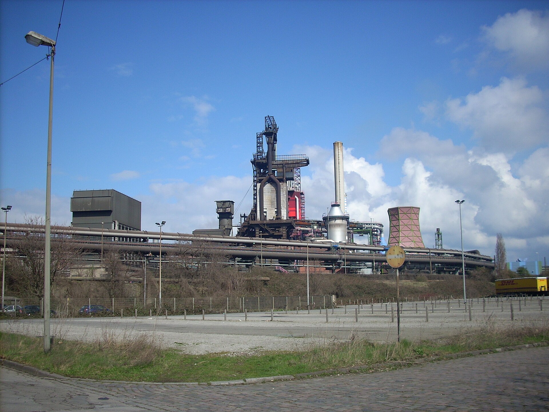 The thyssenkrupp Duisburg steelworks with blast furnace stacks and cooling towers