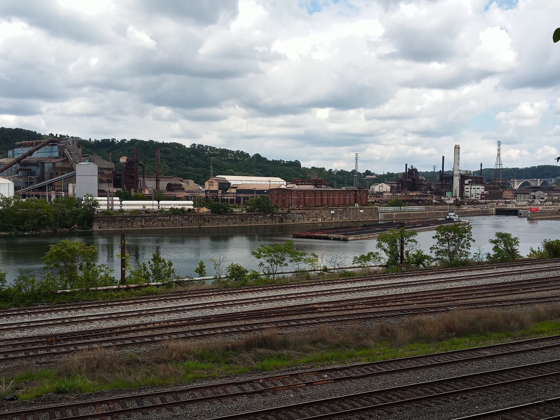 The U.S. Steel Edgar Thomson Works in Braddock, Pennsylvania seen across the Monongahela River with rail lines in the foreground
