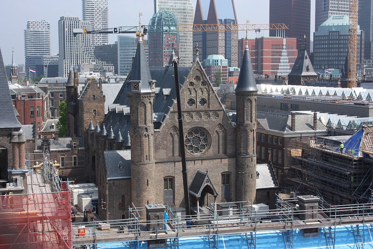 Projects The Ridderzaal at the Binnenhof in The Hague surrounded by scaffolding, cranes and temporary roofs during renovation in May 2026
