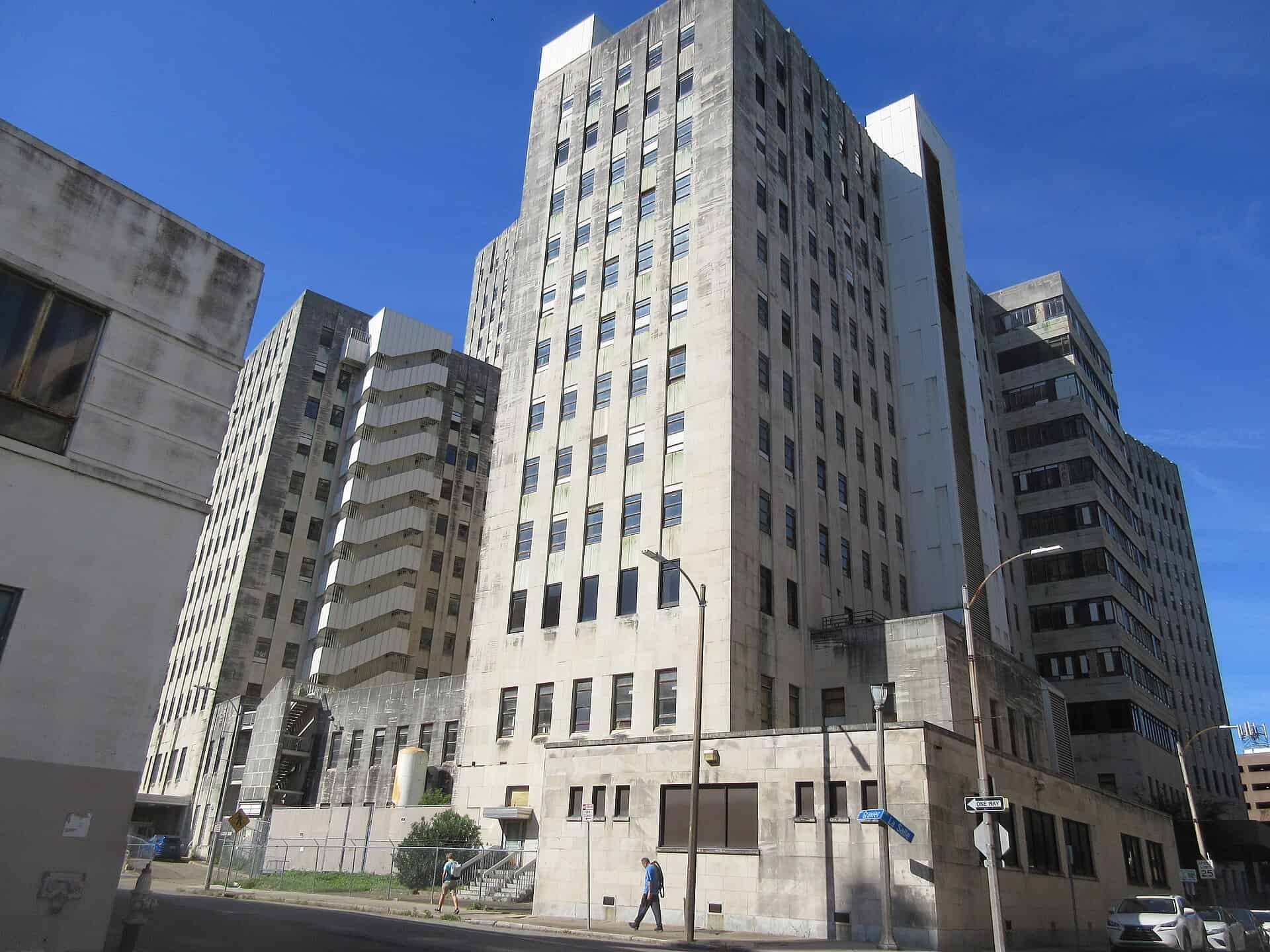 Limestone Art Deco tower and stepped setback wings of the former Charity Hospital in New Orleans