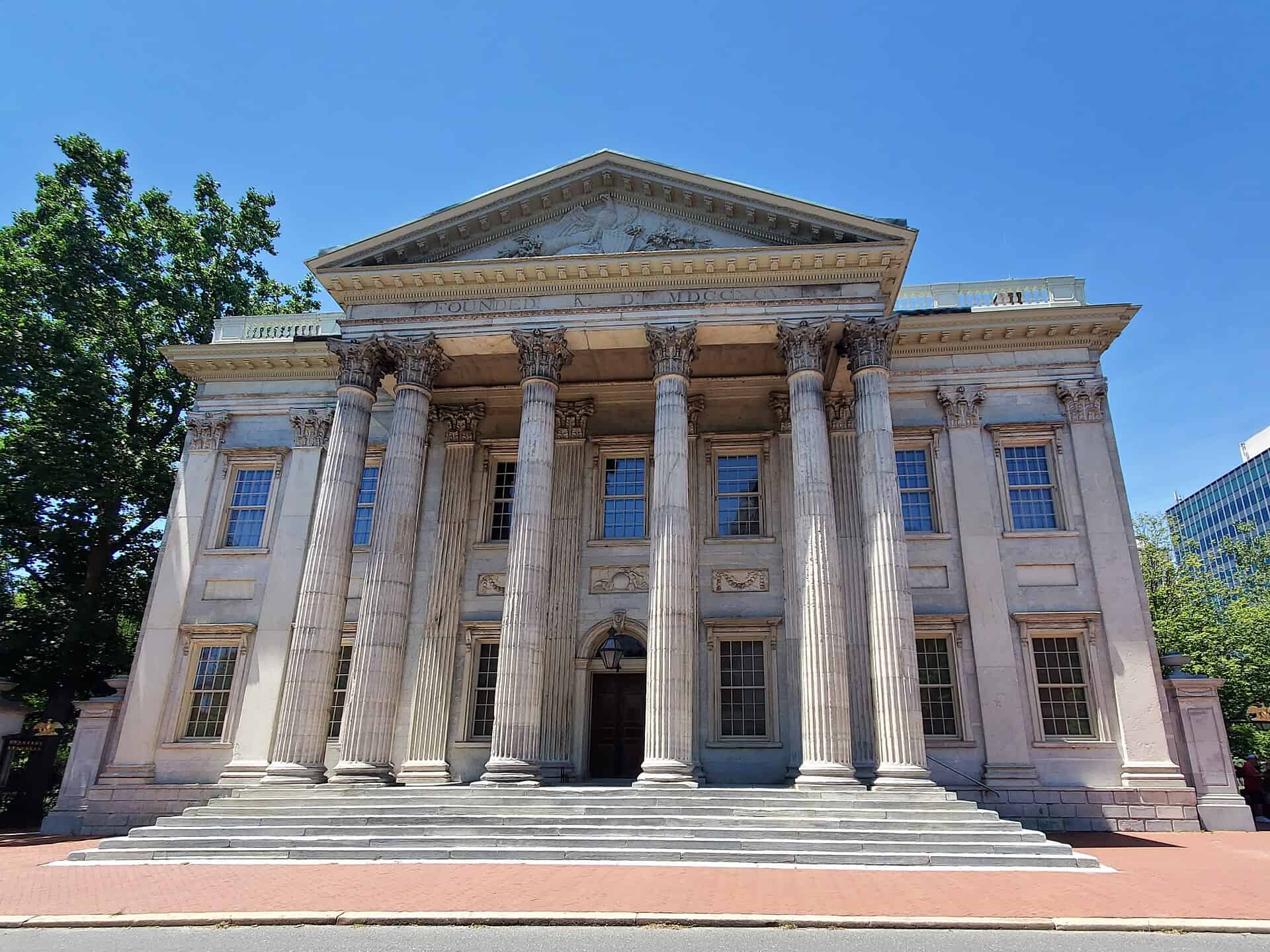 Marble Corinthian portico and flanking brick wings of the First Bank of the United States in Philadelphia