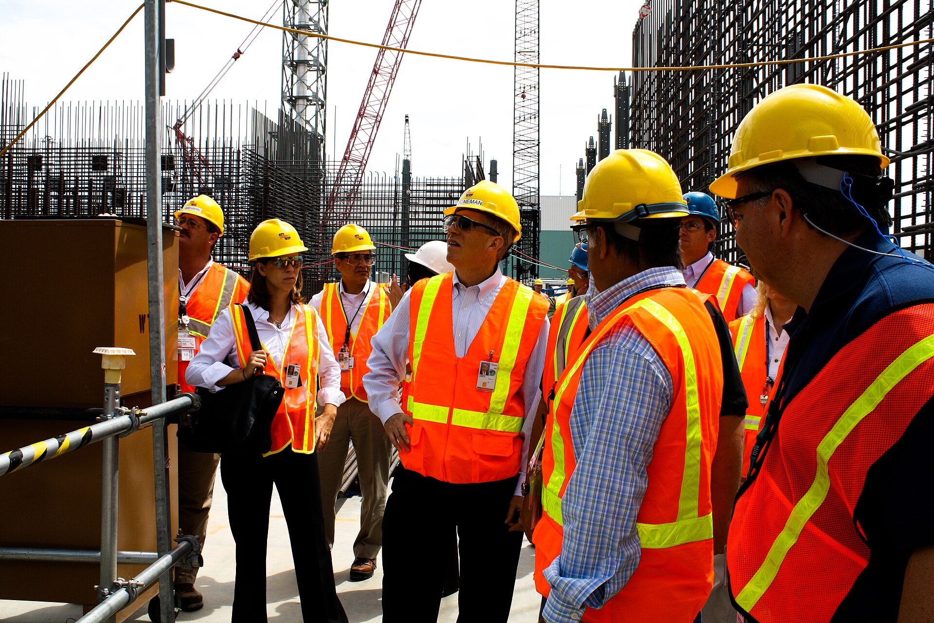 Construction at the Hanford Waste Treatment and Immobilization Plant, with site staff and visitors in the foreground