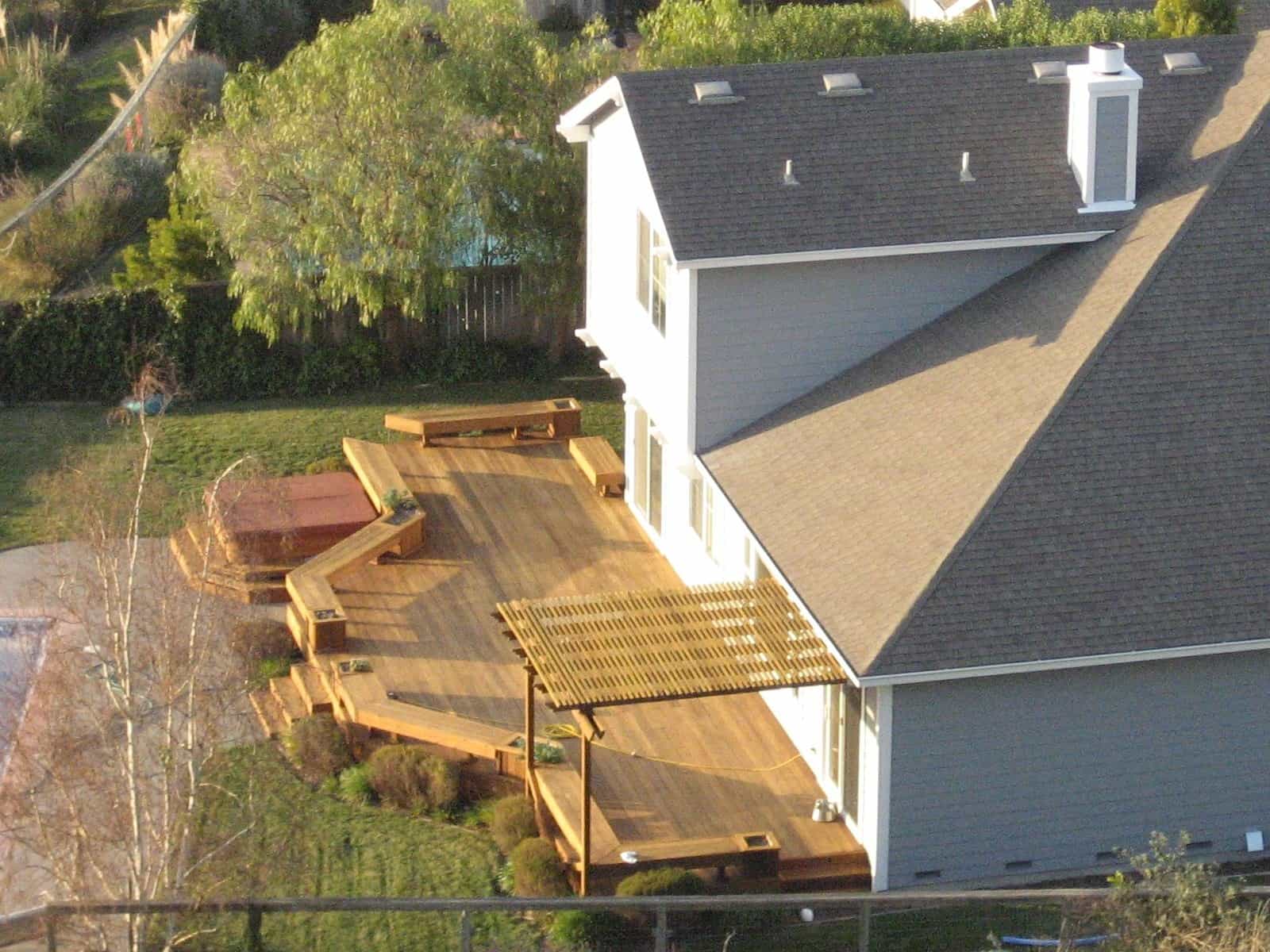 Wood deck and pergola at the rear of a single-family house