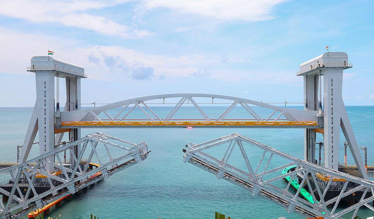 The New Pamban Bridge vertical lift span, with the dismantled 1914 bascule leaves in the foreground