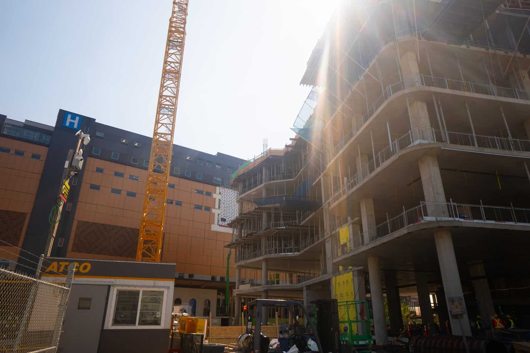 New St. Paul's Hospital under construction in Vancouver's False Creek Flats with tower crane and exposed structural frame