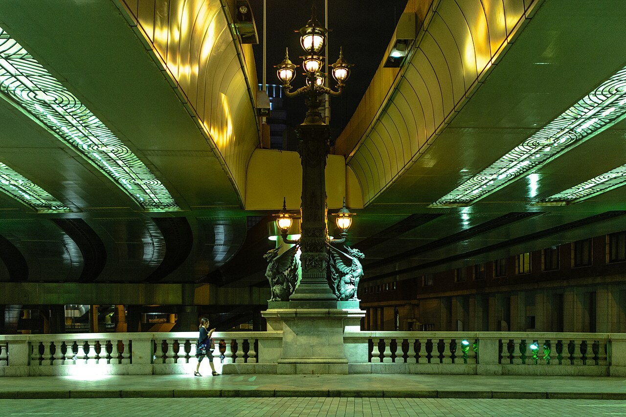 Nihonbashi bridge's ornamental lamp post and kirin statues beneath the elevated Shuto Expressway viaduct in Tokyo