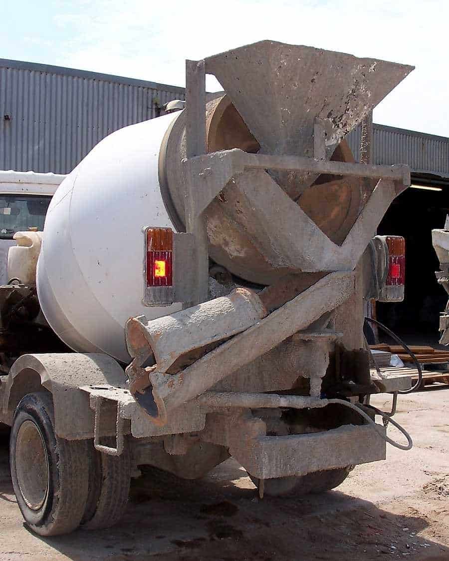 Concrete transit mixer parked at a materials yard