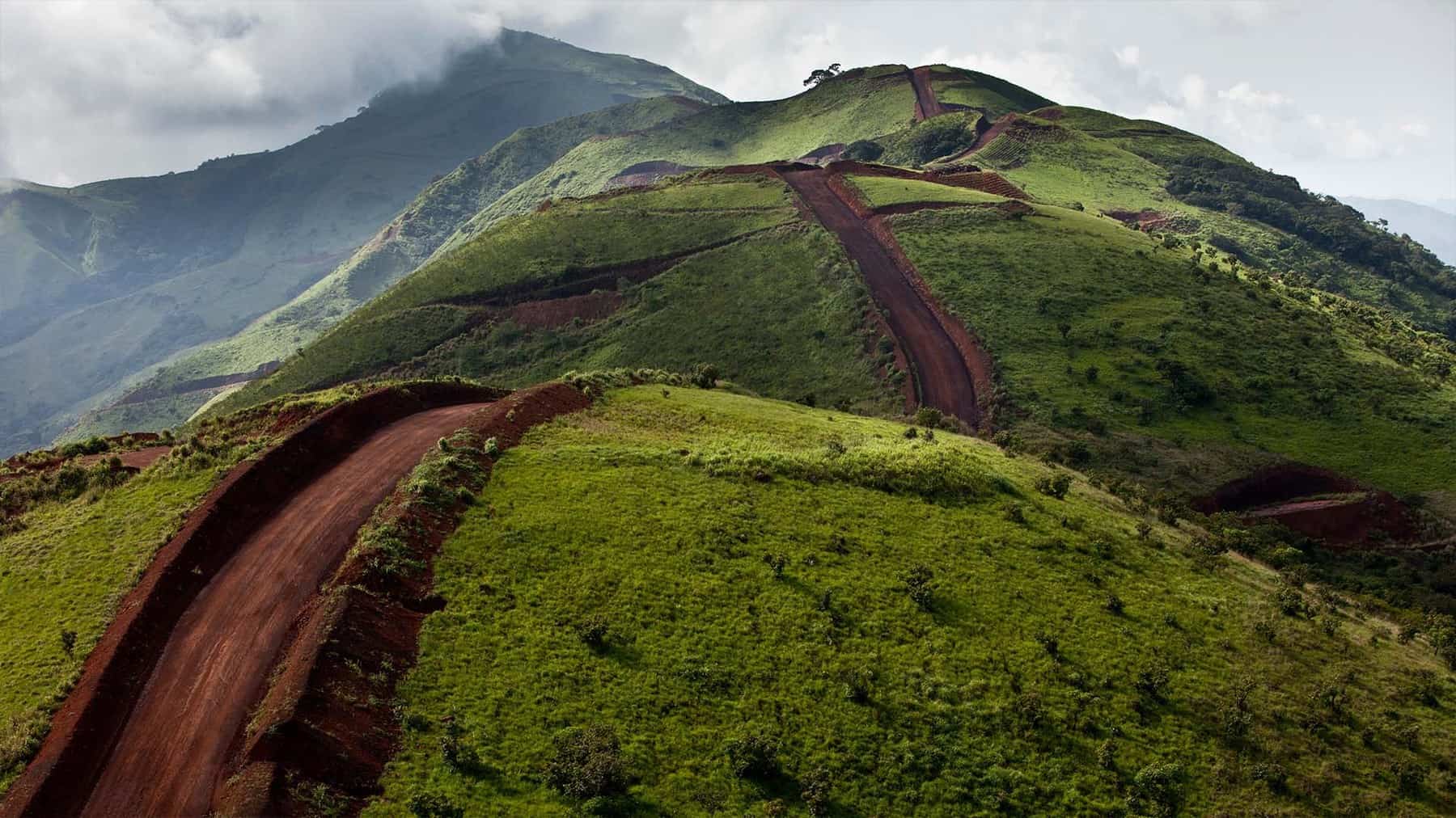 Access road cut into the forested ridgeline of the Simandou range in southeastern Guinea