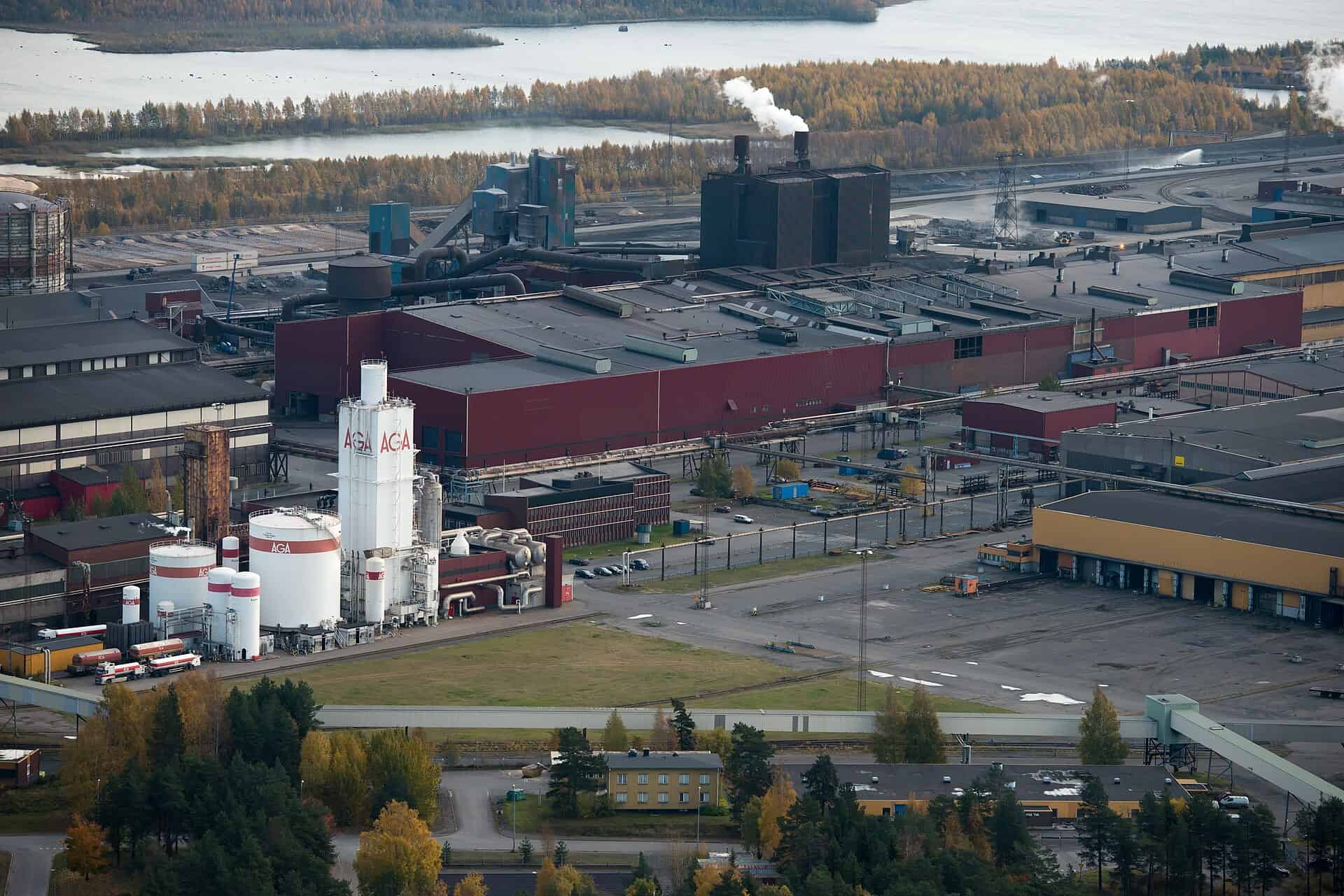 Aerial view of the SSAB steelworks at Svarton in Lulea, Sweden, with plant halls, gas storage tanks and rail sidings