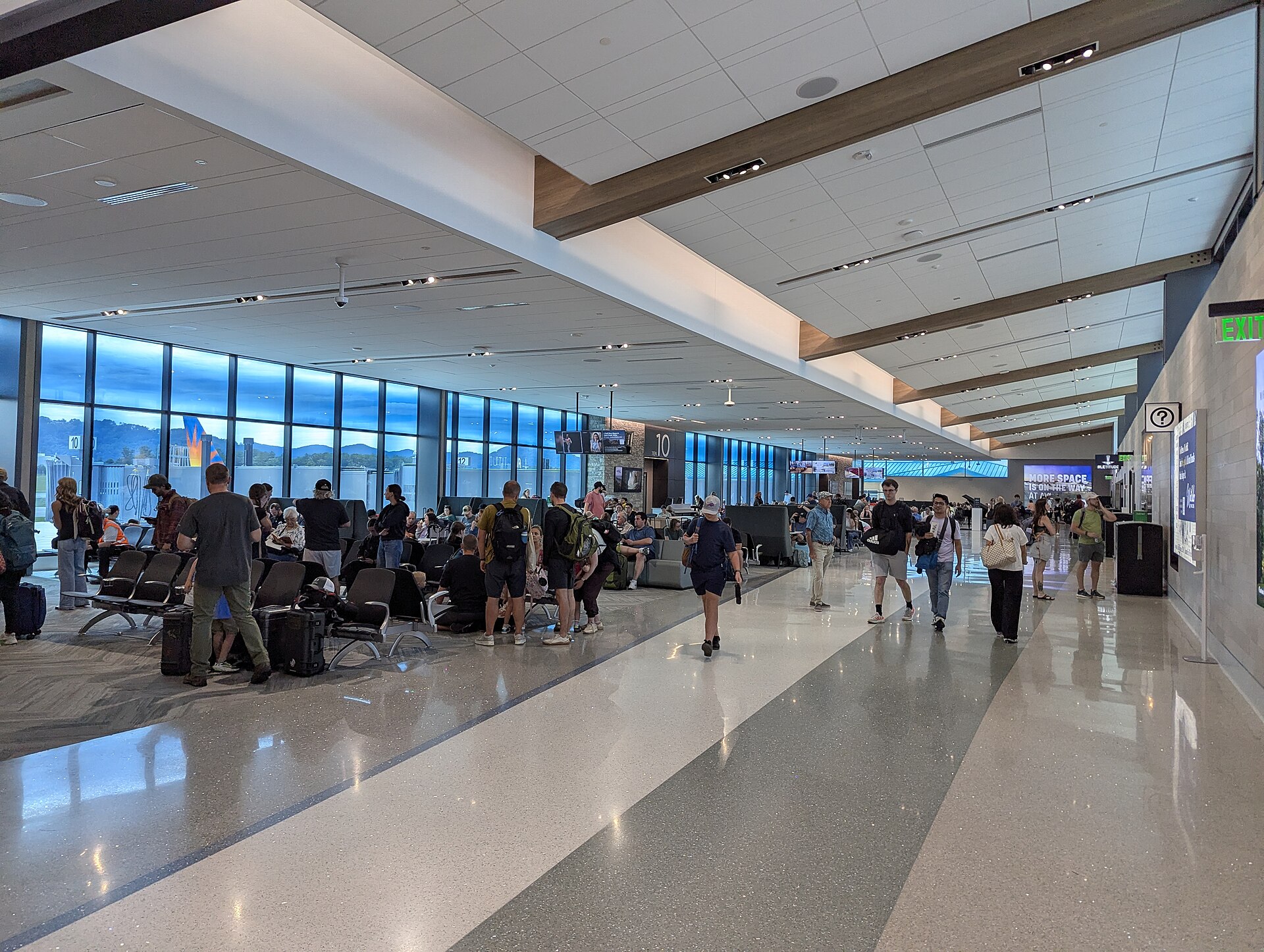 Passengers in the new gate area of the Asheville Regional Airport terminal, June 2026