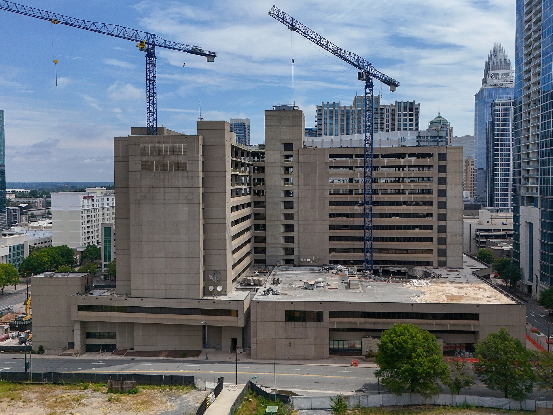 The former Duke Energy headquarters at 526 South Church Street in Charlotte under partial demolition in July 2025, with two tower cranes