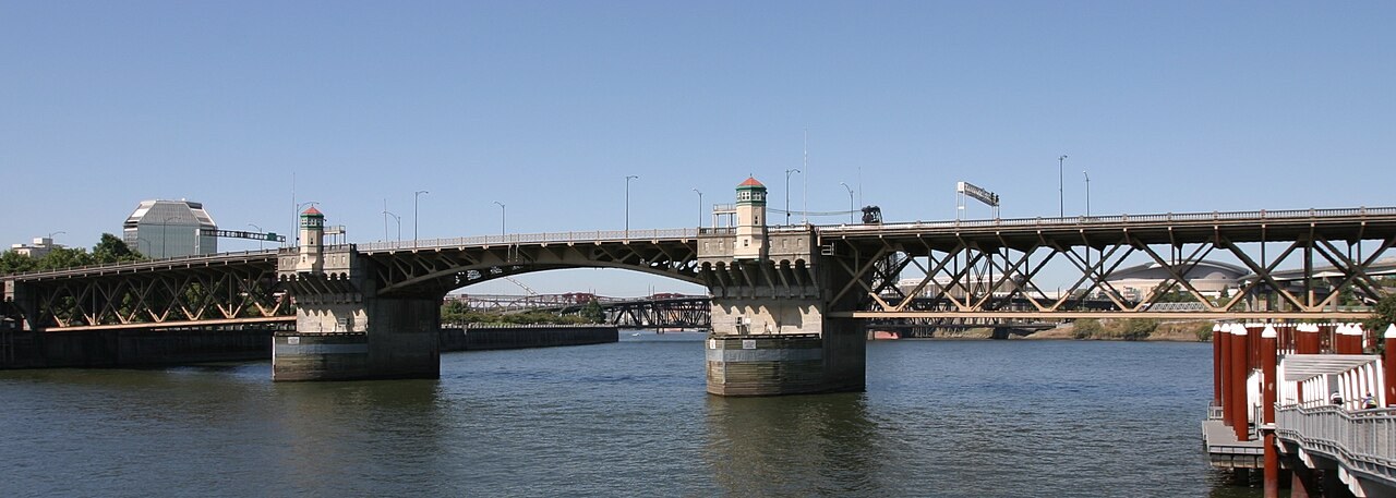 The existing 1926 Burnside Bridge over the Willamette River in Portland, with its two Italianate tower houses flanking the bascule span