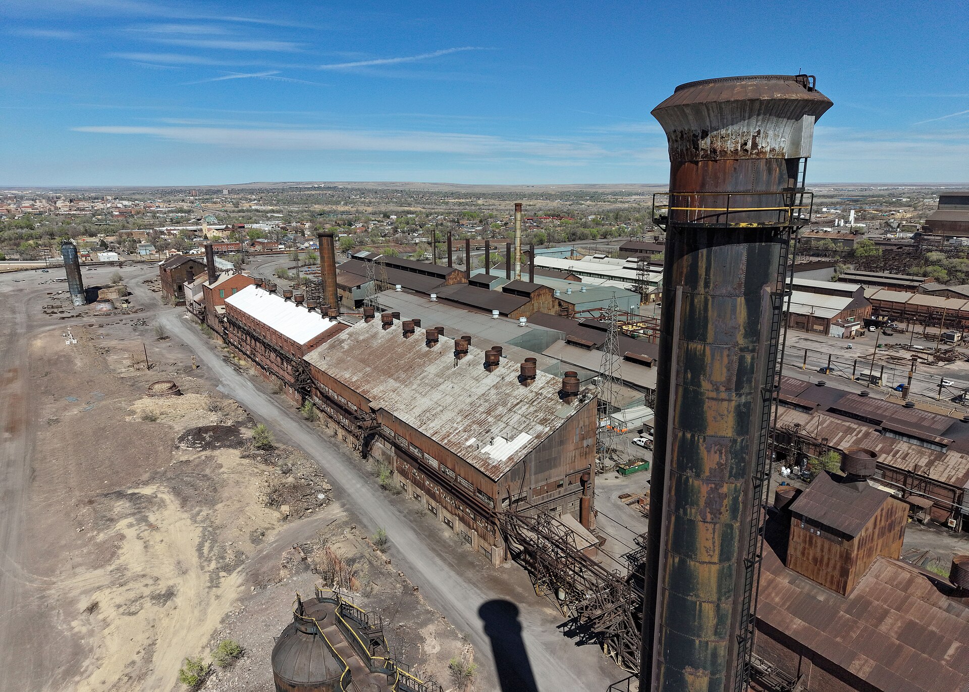 Aerial view of the steel mill in Pueblo, Colorado, in March 2026, with a rusted stack in the foreground