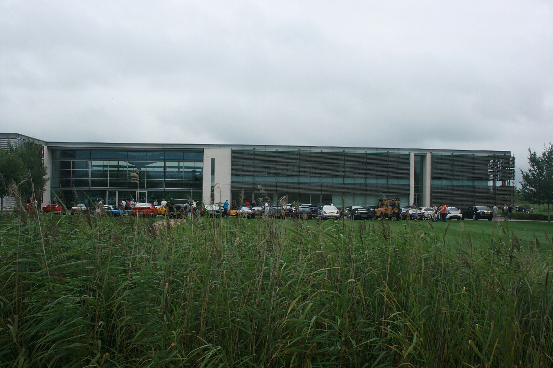 Glazed two-storey facade of the Rolls-Royce Motor Cars plant at Goodwood, West Sussex